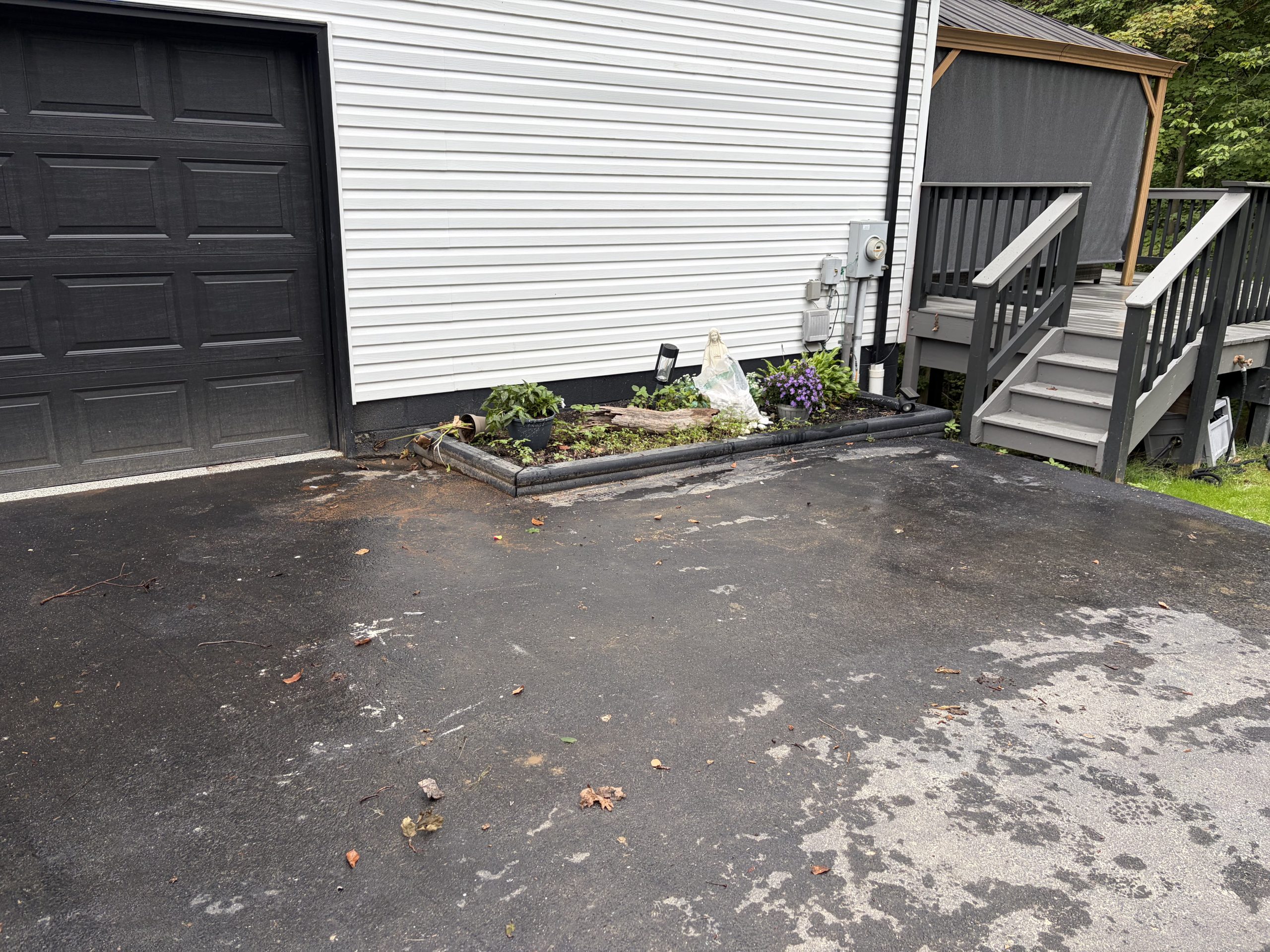 Clean driveway after junk and household items were removed